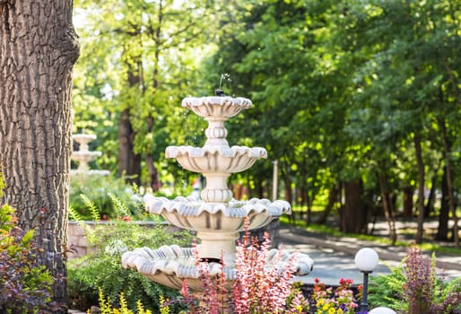 Beautiful fountain multi-tiered in the green park.