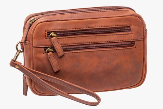Leather handbag isolated. Close-up of brown businessman luxury leather wrist handbag. Fashionable brown leather briefcase or bag for men.