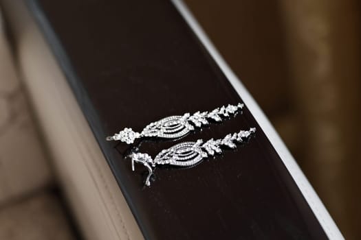 a pair of a silver earrings. jewelry