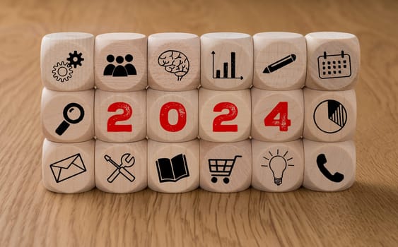 Dice with icons and the Year 2024
