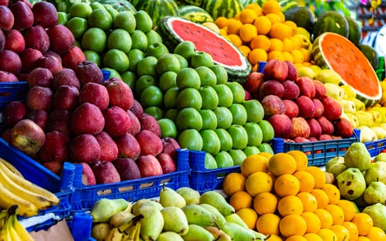 Variety of fresh fruits put out on sale on the street stall.