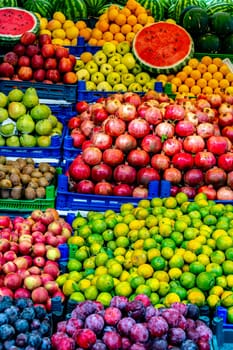 Variety of fresh fruits put out on sale on the street stall.