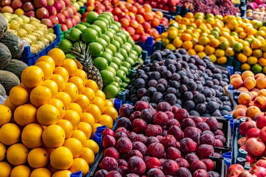 Variety of fresh fruits put out on sale on the street stall.