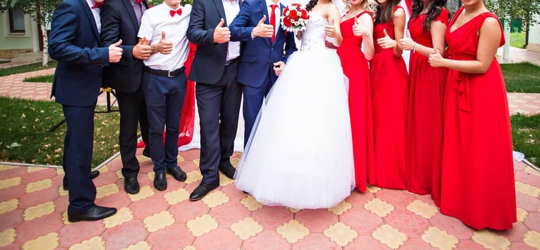 Friends of bride and groom on the wedding ceremony outdoors