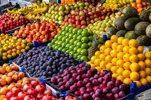 Variety of fresh fruits put out on sale on the street stall.