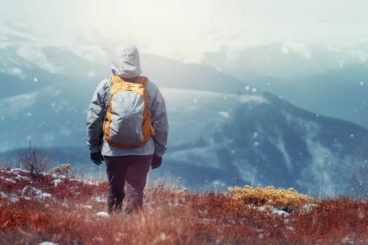 Traveler with backpack hiking in mountains on winter day. Winter season. Exploring wild nature places. Adventures during winter trekking. Mountains exploration. Backpacker while winter trip. Freedom of exploring