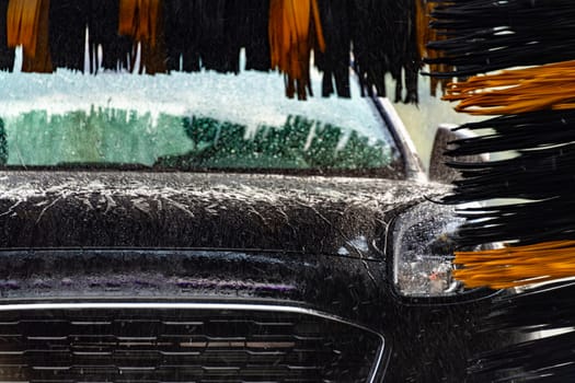 A vehicle in an automatic car wash.