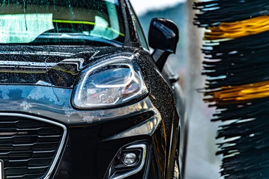 A vehicle in an automatic car wash.
