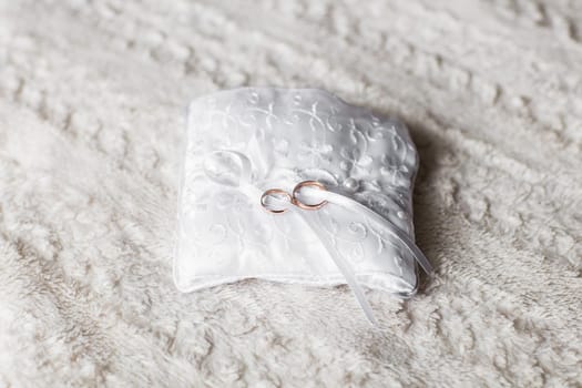 Close-up of wedding rings. Two gold wedding rings, jewelry for wedding