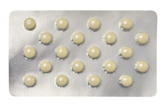 Blister pack with round pills on a white isolated background, top view