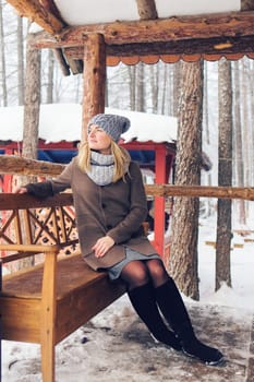 Attractive young woman in winter time outdoor.