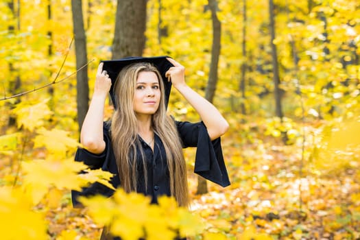 young witch in a forest. Halloween Witch