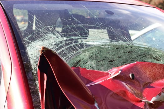 Car damaged in a traffic accident with a broken windshield