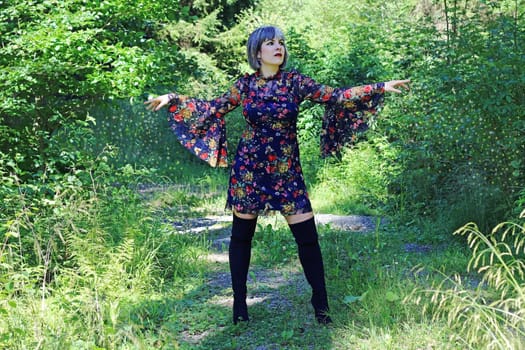 A young woman in the forest. A fairy queen works her magic in the forest