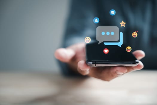Connected through technology man on phone chats live, discussing social network concepts. Chat box icons appear, representing digital communication trends.