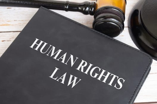 Top view of Human Rights Law book with gavel background. Law concept.