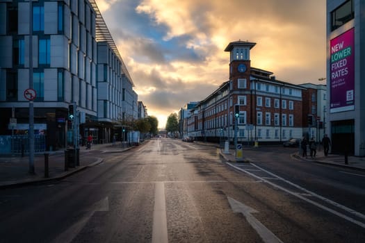 Dublin, Ireland, 10 Oct 2020 Dramatic and moody sunset at Pearse St with mixture of modern and traditional buildings, shops and restaurants