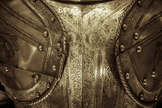 Antique armour on black background. Concept for security, safety and fantasy