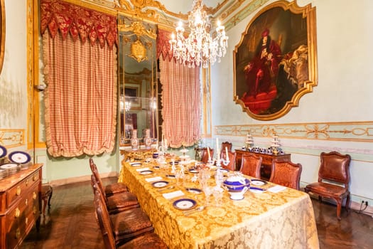 Genova, Italy - 8 August 2023: Spinola Palace. Vintage luxury dining room, elegant furniture - table and chairs