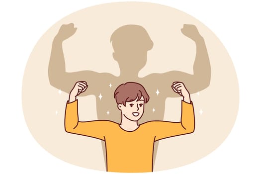 Smiling boy dream on having muscles