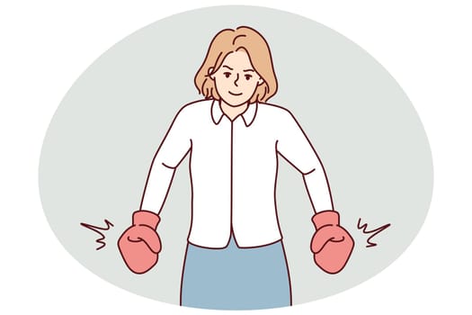 Strong businesswoman in boxing gloves