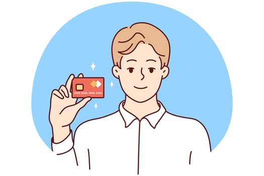 Smiling man posing with bank card