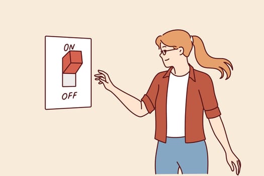 Woman turns off switch to save electricity and care for environment or avoid large utility bills. Concept of day without electricity to draw attention to problem of environmental pollution