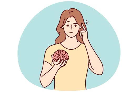 Young woman hold brain pint at head