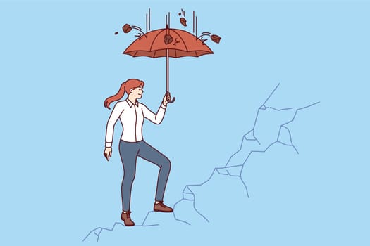 Business woman climbing cliff using umbrella to protect herself from falling stones, for concept of career ambitions. Girl strives for success and achieving goals when creating own business