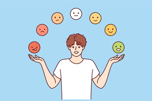 Man is trying to maintain emotional balance by juggling emoticons with positive and negative emotions. Guy develops emotional balance to avoid psychological turmoil and stress or depression