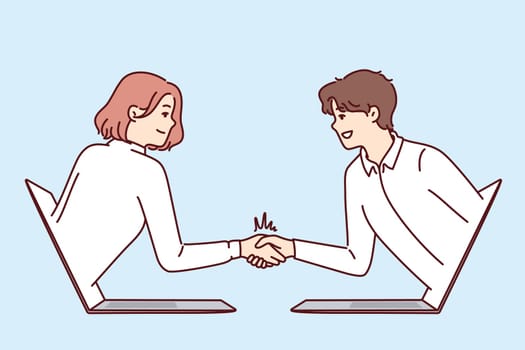 Handshake of business people leaning out of laptop and making remote negotiations via internet connection. Handshake of man and woman working in large corporation and making video call