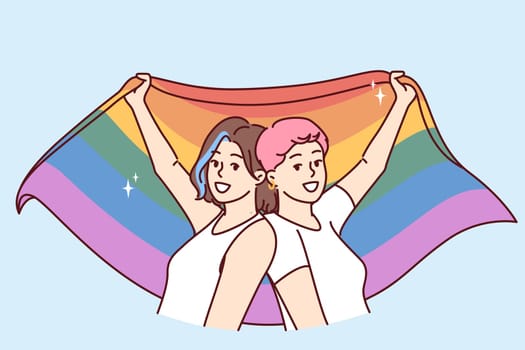 Lesbian women keep LGBT wet by participating in pride month parade and calling for more tolerant queer people. LGBT female fight for rights gays and transsexuals or transvestites from LGBTQ community