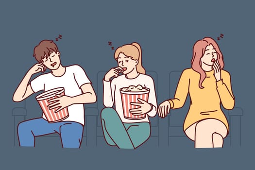 People watch boring movie at cinema and fall asleep with buckets of popcorn in hands because movie doesn have good script. Viewers of night session in cinema experience boredom and lack of interest