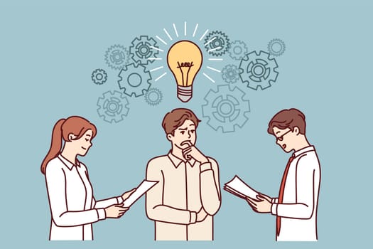 Business partners are brainstorming, discussing new ideas for development of company, standing with large light bulb over heads. Boss listens to ideas of subordinates to improve startup workflows