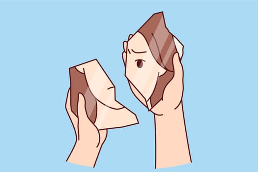 Woman looks into broken mirror symbolizing psychological problems and need to take antidepressants. Hands girl with psychological disorder caused by breakup with boyfriend or death of parents