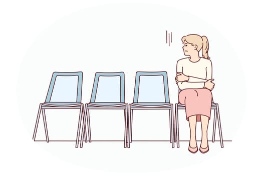 Anxious young woman sit on chair in corridor waiting or appointment. Stressed female feel worried wait in line in hallway. Vector illustration.