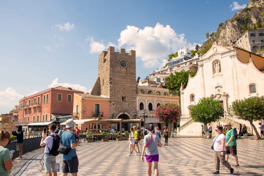 Sicily, Taormina, Italy - 28 September 2023. City views, facades, architecture and the most popular streets. Tourists at Mainsquare Piazza IX Aprile and San Giuseppe church.