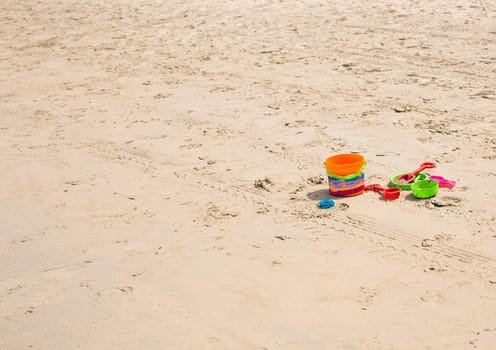 kids toys on tropical sand beach. Summer