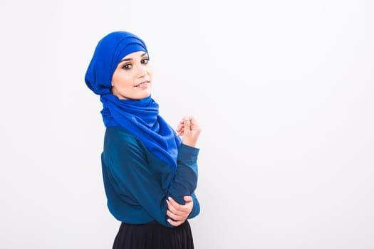 Portrait of young muslim woman wearing traditional arabic clothing.
