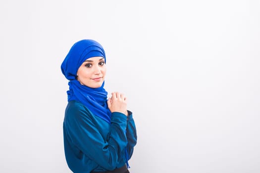 Attractive muslim woman on white background, studio shot
