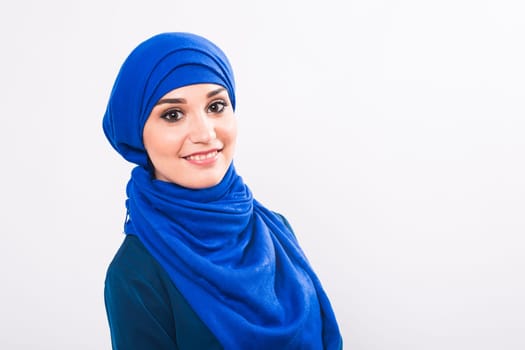 beautiful asian muslim woman model posing on white background in studio.