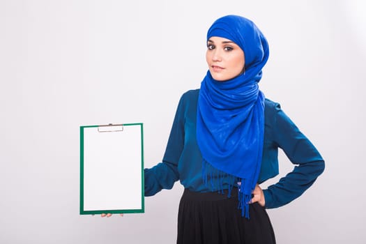 Arabic Muslim beautiful woman holding banner for your text.