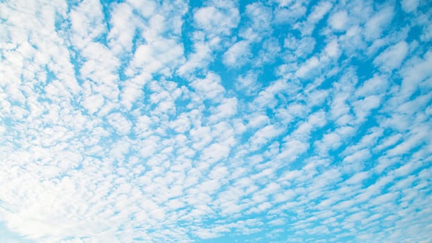Blue sky background with clouds. Beauty clear cloudy sunshine calm bright texture. Vivid cyan landscape in spring day environment