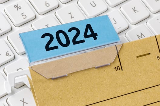 A brown file folder labeled with 2024