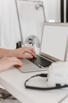 Female working on the laptop, blank screen template.