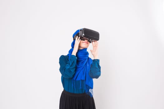 Muslim woman using VR headset. technology, vr, people and game concept.