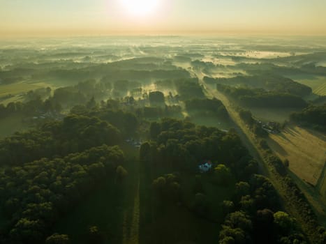 aerial view of a beautiful sunrise over a misty landscape
