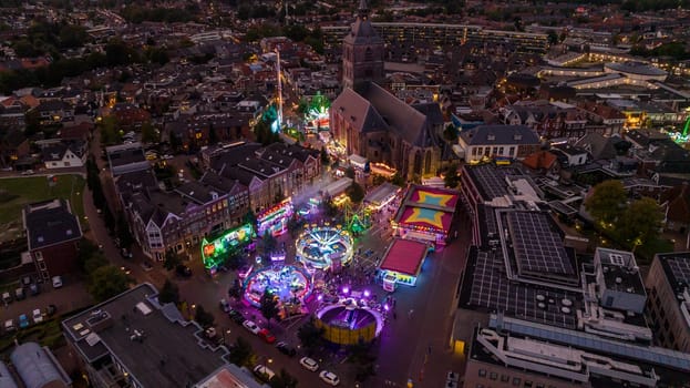 OLDENZAAL, NETHERLANDS - SEPTEMBER 30, 2023: Aerial evening view of the annual fair in the city center
