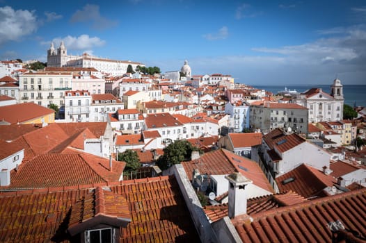 Famous view of Lisbon city with Tage river and Alfama district