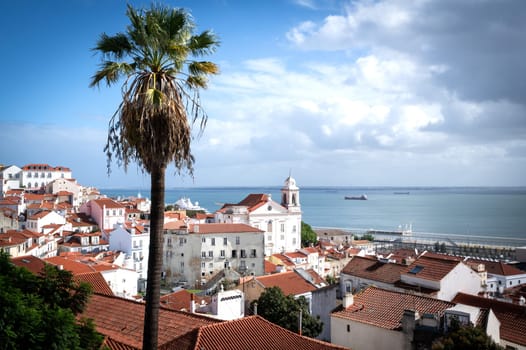Famous view of Lisbon city with Tage river and Alfama district